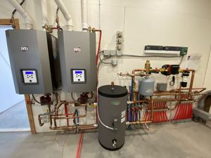 13,000 square foot new construction dual boiler system for radiant flooring and a hydronic fan coil heater for an indoor green house