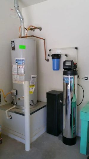 A water conditioner installed in a home's water supply line before the tanked water heater