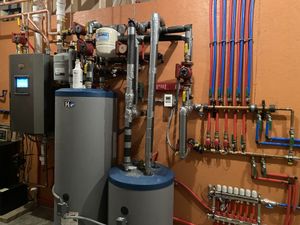Boiler system for high end residential home to provide heat to radiant flooring and domestic hot water for approximately 5000 square feet