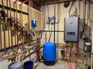 A combi boiler for domestic hot water and radiant flooring in a home's basement