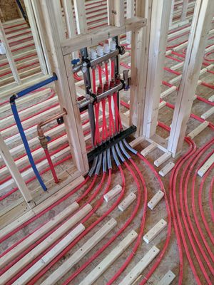 A manifold for a new construction in floor radiant heating system