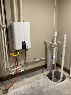 An installed tankless water heater in the basement of a new construction home